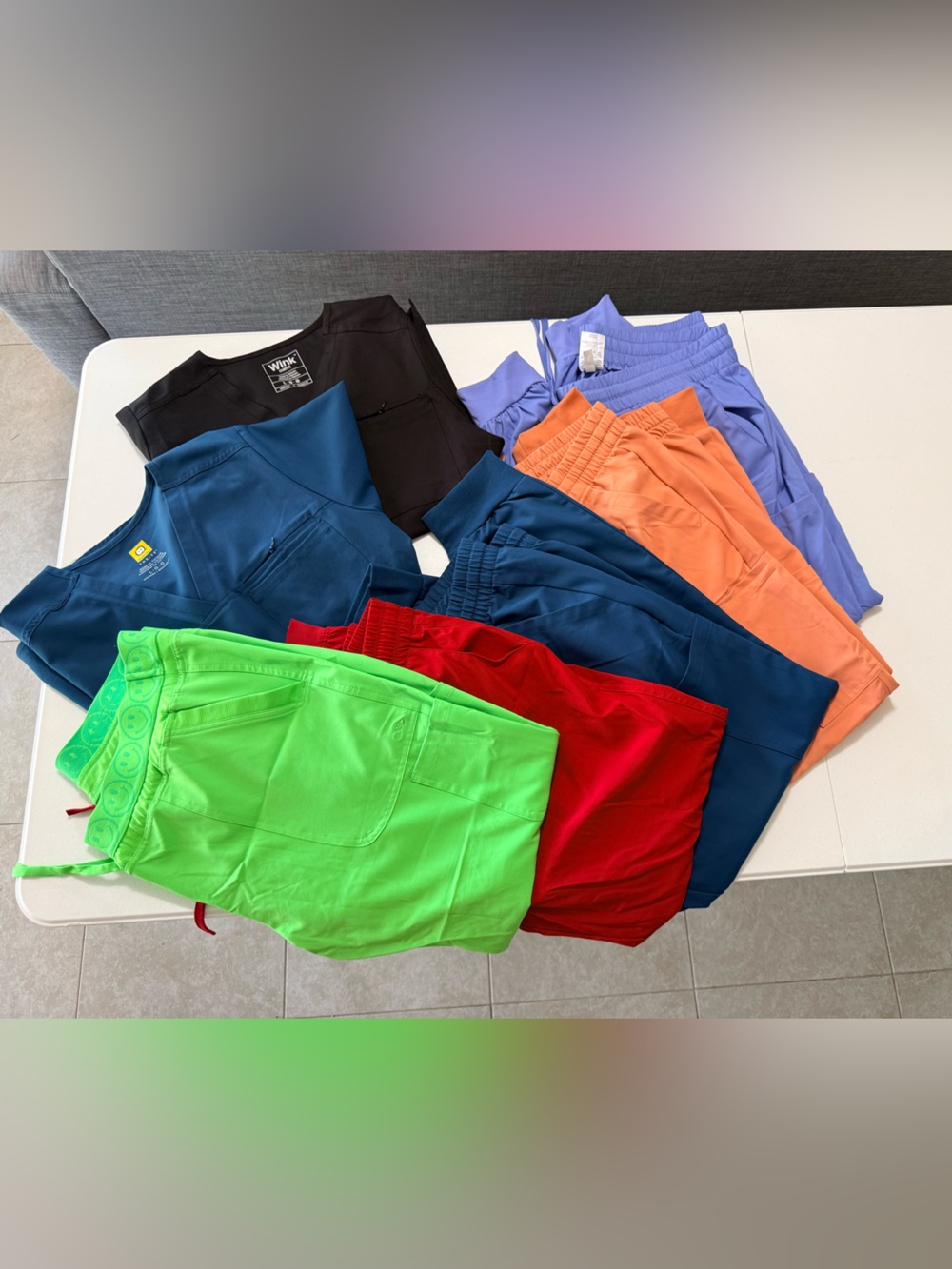 Wink joggers and scrub tops. Red pair sketchers joggers.